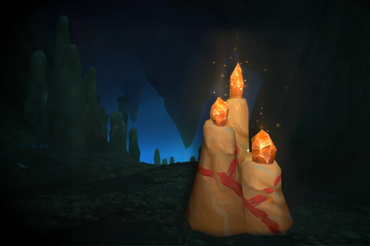 Glowing crystal candles lighting a dark cave interior.