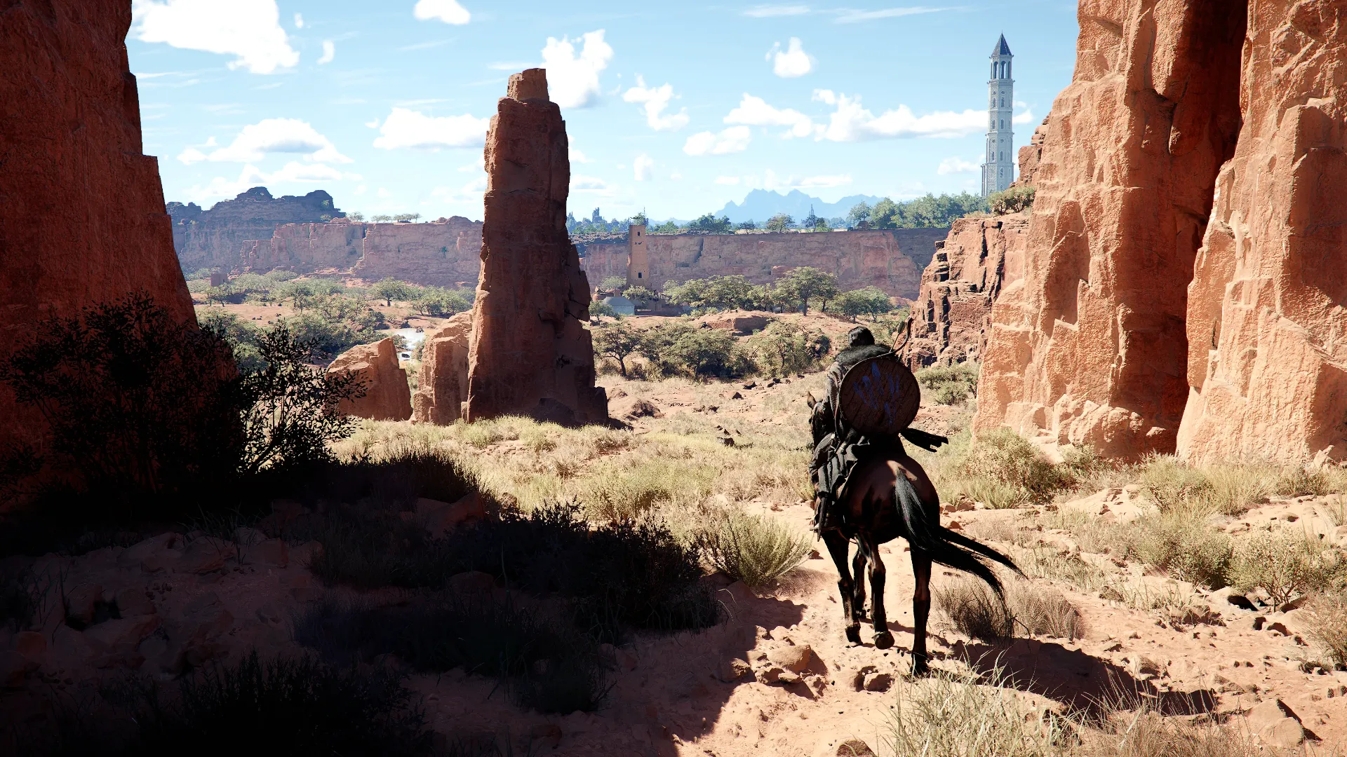 Crimson Desert gameplay screenshot showing a rider on horseback traveling through a canyon in the open world of Pywel.