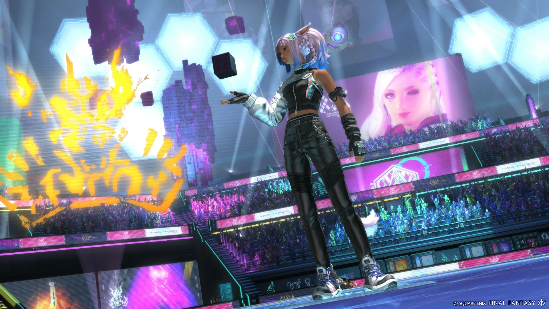 A female performer on stage in front of many fans in a futuristic settings